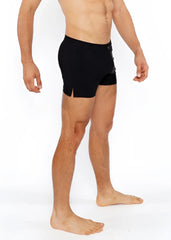 Black pinstripe swim short featuring sleek form-fitting athletic design with subtle side slits for enhanced comfort
