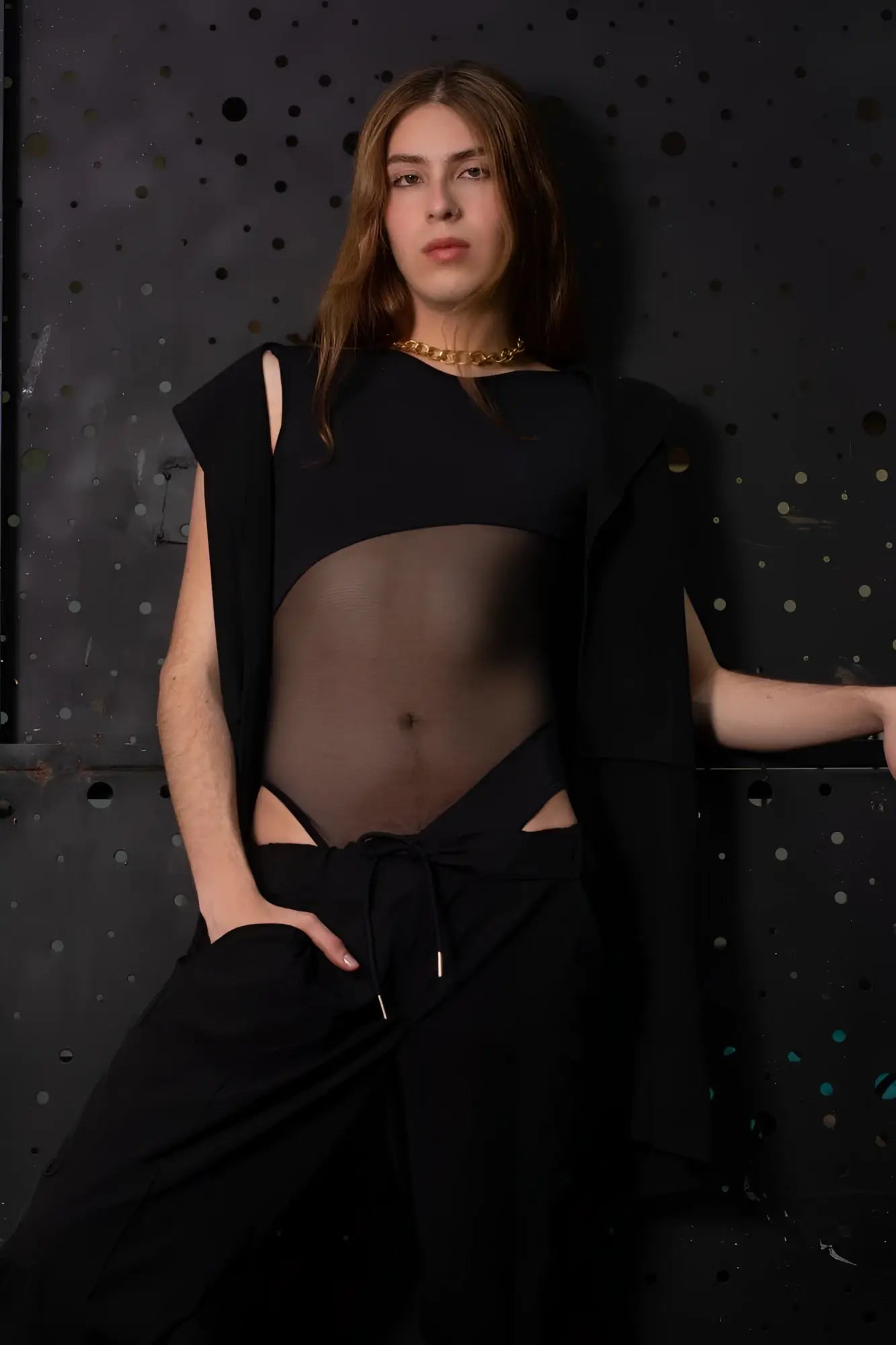 Black sheer PLURAL PL002 bodysuit with cut-out details and draped sleeve for stylish layering and comfort