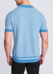 Light blue short-sleeved honeycomb textured knit shirt with subtle hexagonal pattern and matching ribbed trims