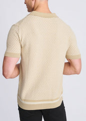 Beige short-sleeved polo shirt with honeycomb textured knit pattern and ribbed collar cuffs and hem