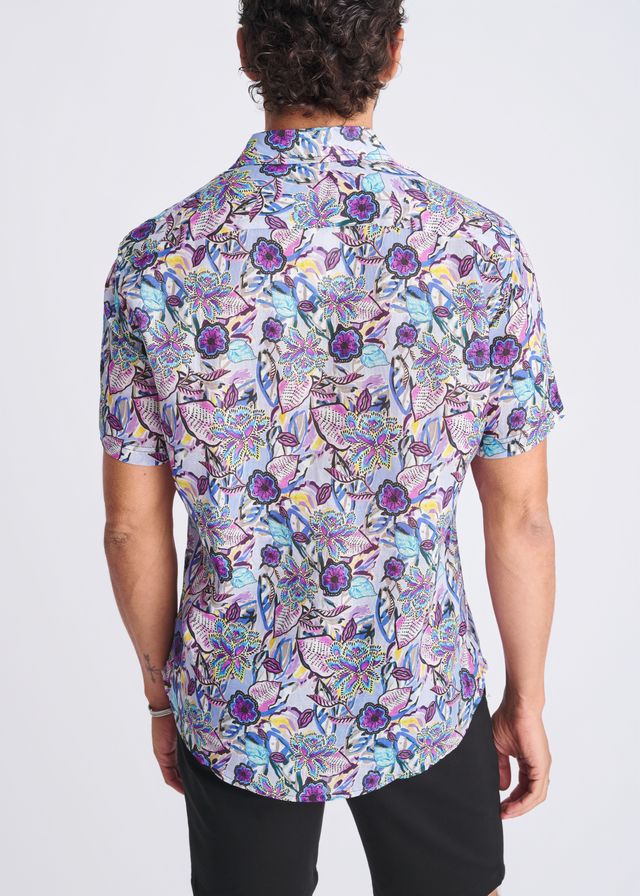 A vibrant floral lightweight linen tencel short-sleeved button-up shirt in purple blue and pink on light background
