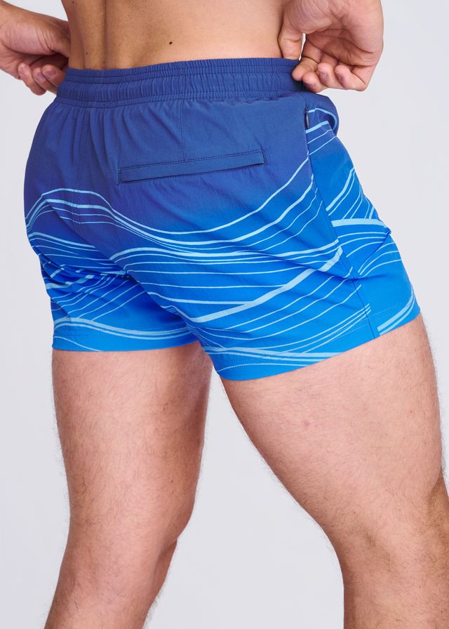 Blue waves print swim shorts with white wavy line pattern and mesh lining for comfortable water activities