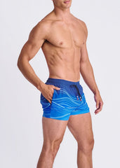 Blue waves print swim shorts with white wavy patterns black drawstring waistband and mesh lining for quick drying