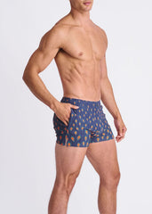 Peacock feathers seersucker swim shorts in blue with orange and yellow leaf motifs and mesh lining