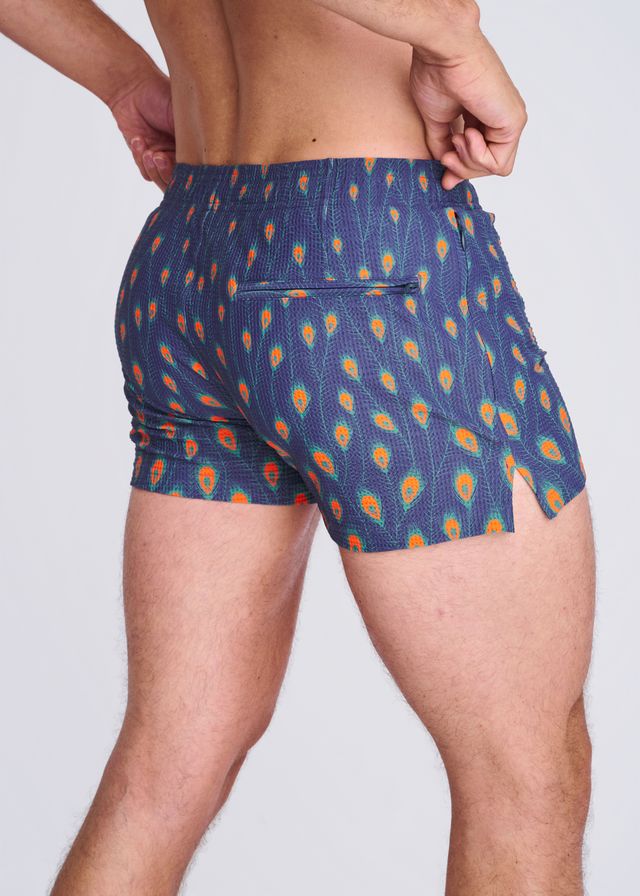 Blue peacock feathers seersucker swim shorts with vibrant orange teal pattern elastic waistband and side slit