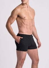 Black seersucker swim shorts with mesh lining in sleek form fitting design and side pockets