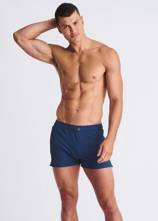 Navy blue riviera seersucker swim shorts with mesh lining and single button waistband closure for athletic use