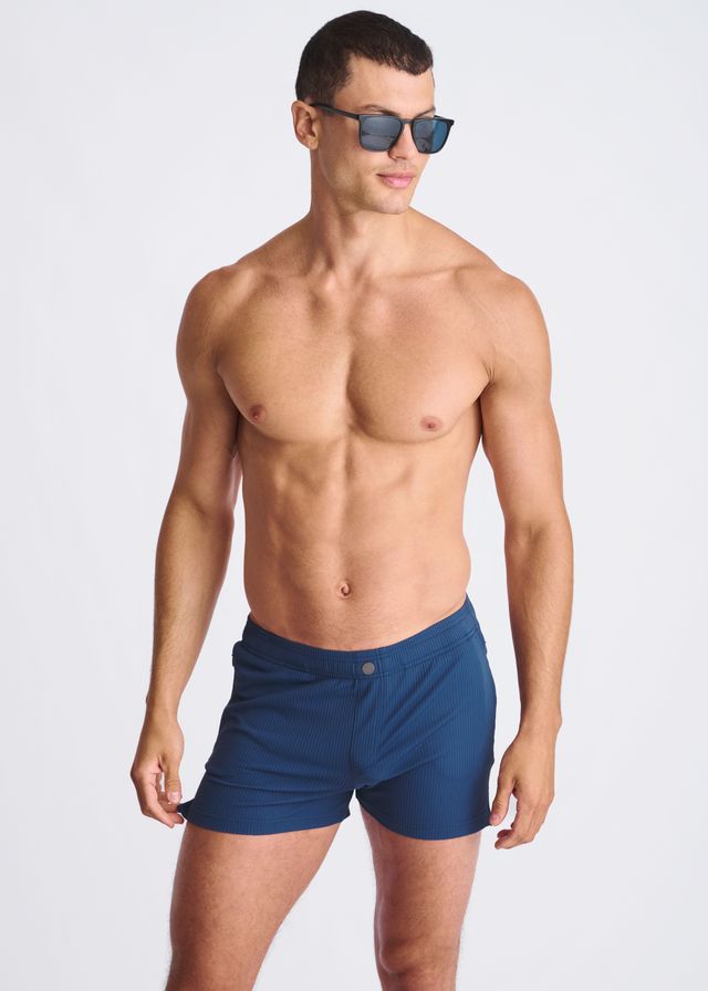 Navy blue Riviera seersucker swim shorts with mesh lining and single button waistband closure for athletic use
