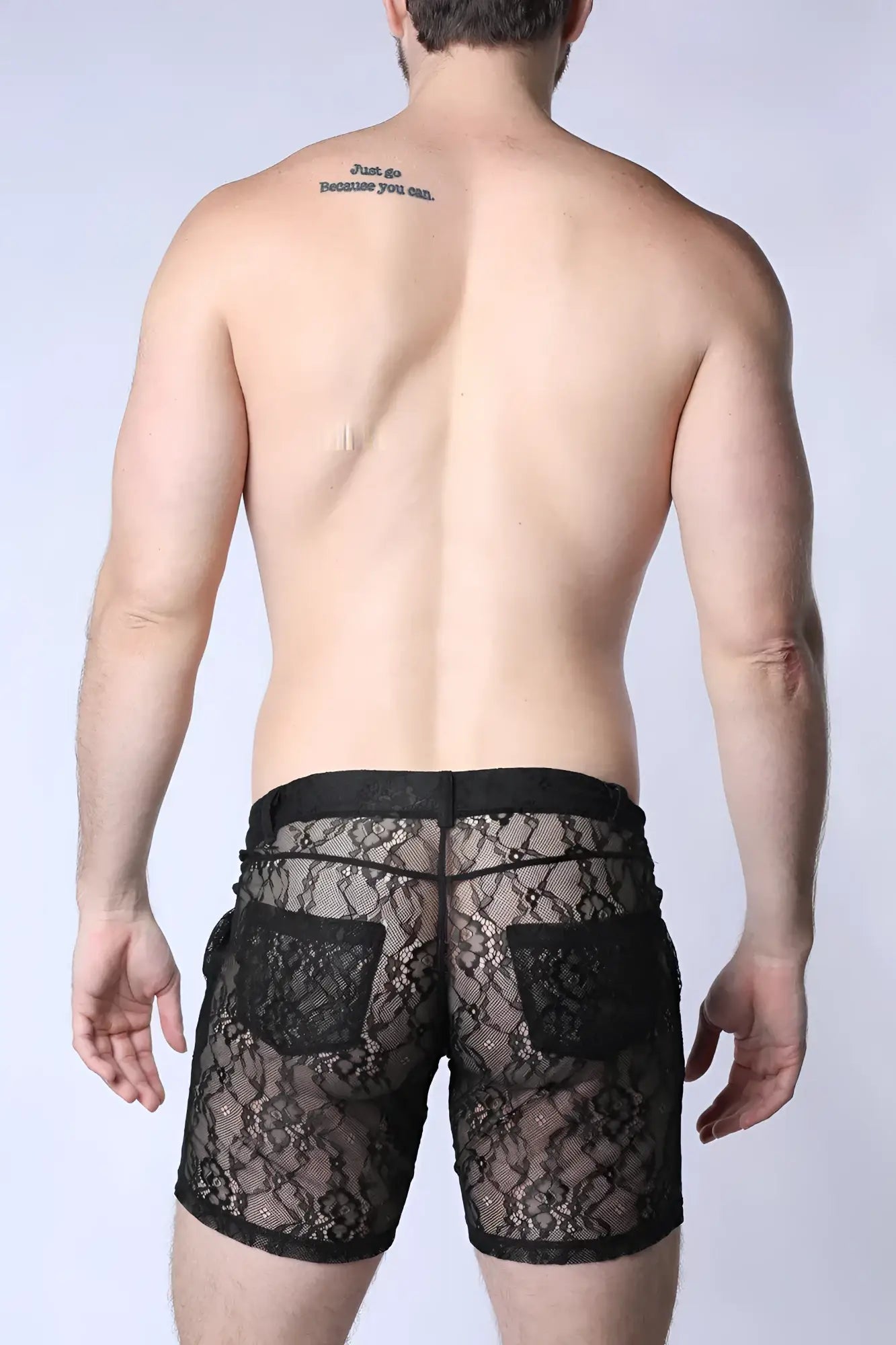Black lace shorts positan with intricate floral patterns and solid black fabric accents at waistband and pockets