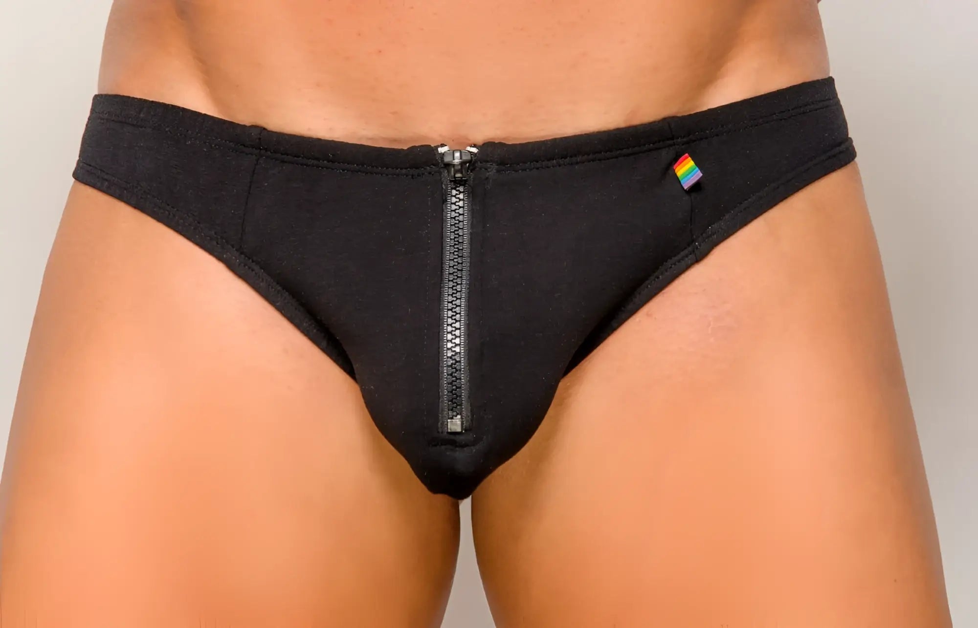 Black men’s briefs with central zipper and rainbow flag patch pride zip it thong in black cotton blend