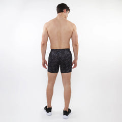 Black printed mesh stretch performance shorts with subtle geometric leaf pattern for athletic use