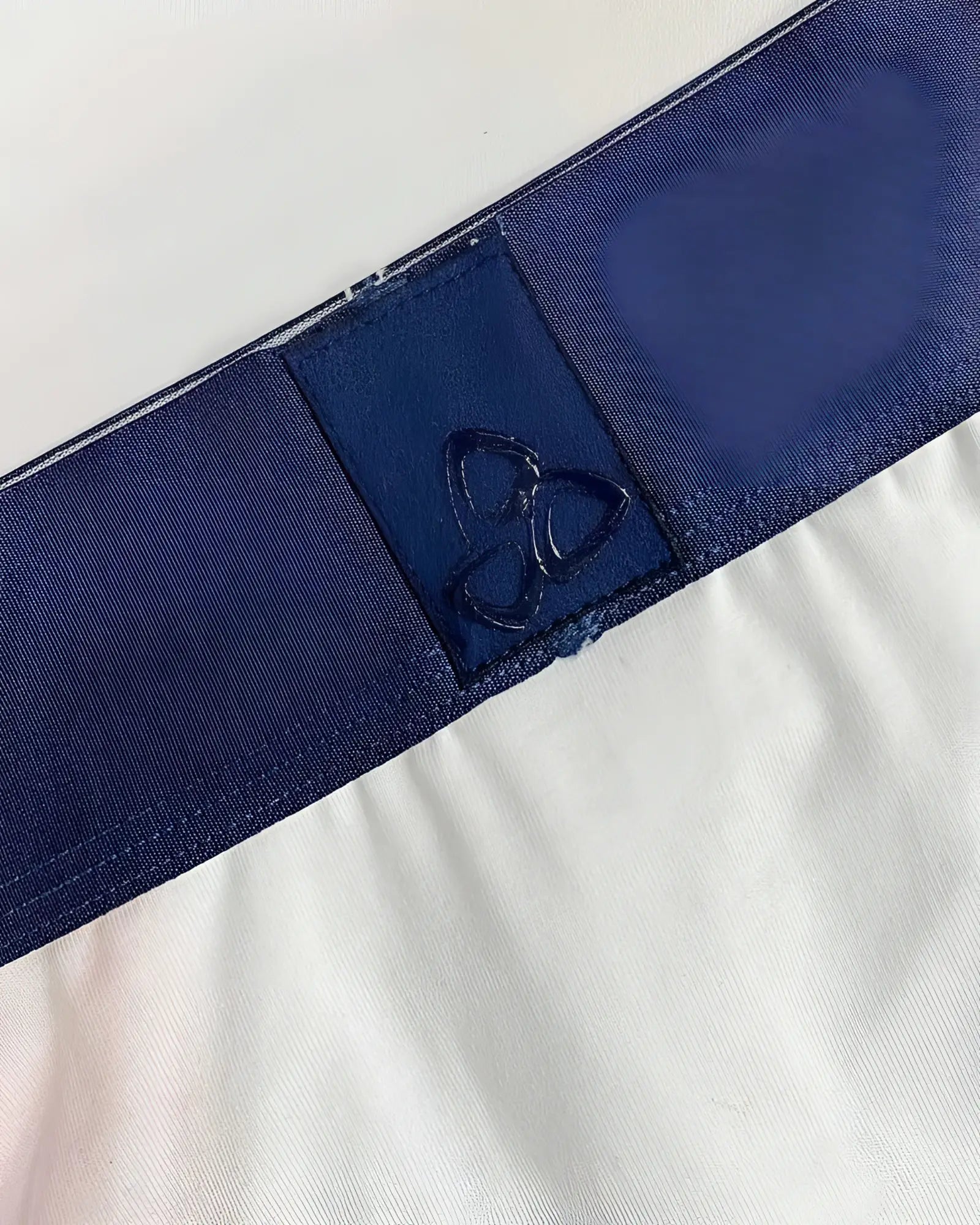 Private structure baut4388 athlete mini briefs in white with a dark blue elastic waistband and subtle embroidered logo patch