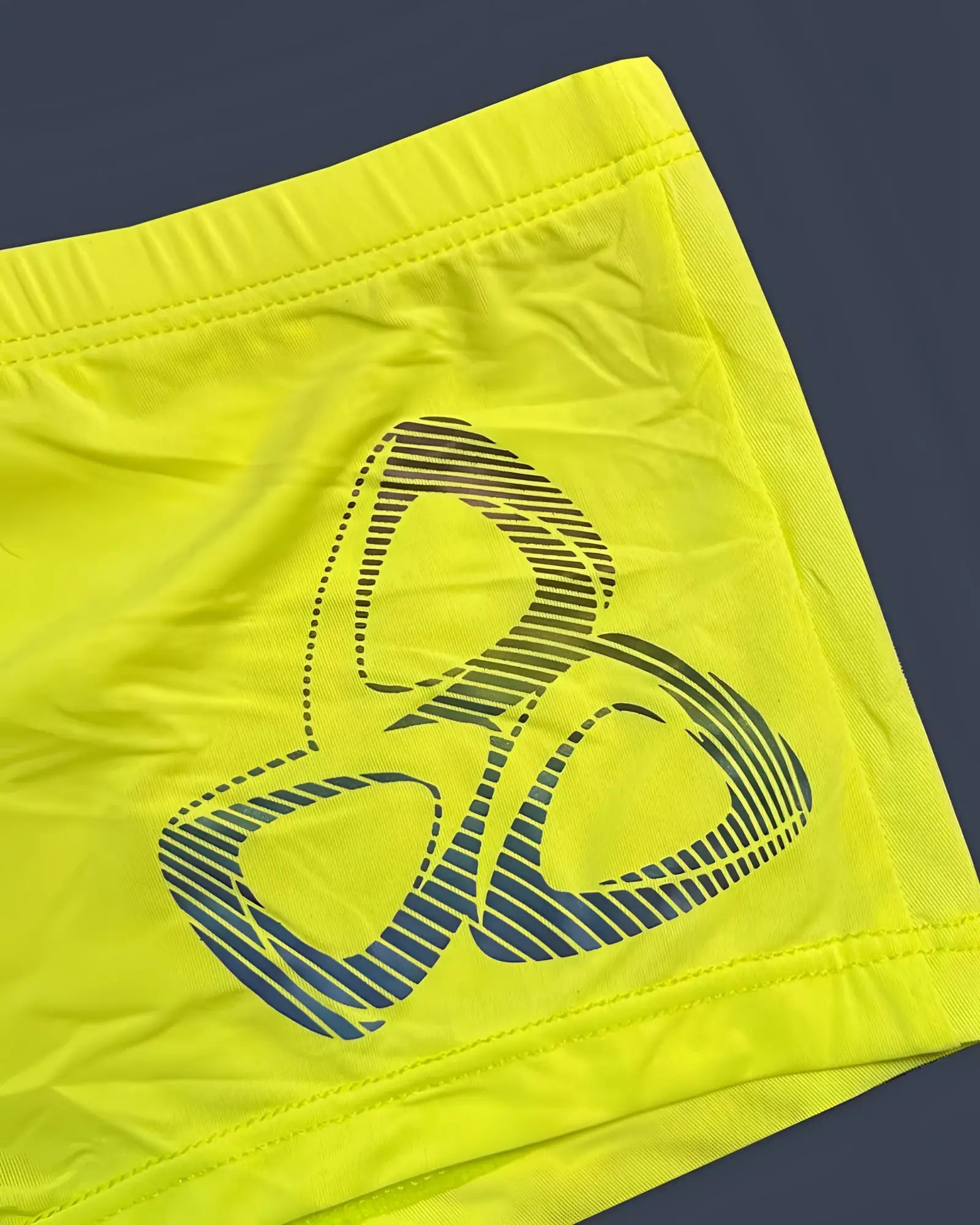 Bright neon yellow private structure brut4390 bare hipster shorts with bold blue and black three-ring logo design