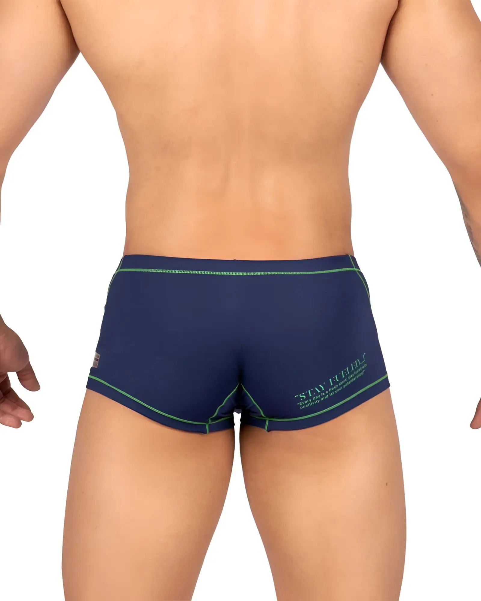 Back of private structure epus4570 prime elysian hipster navy blue swim trunks with green trim and stay firm logo