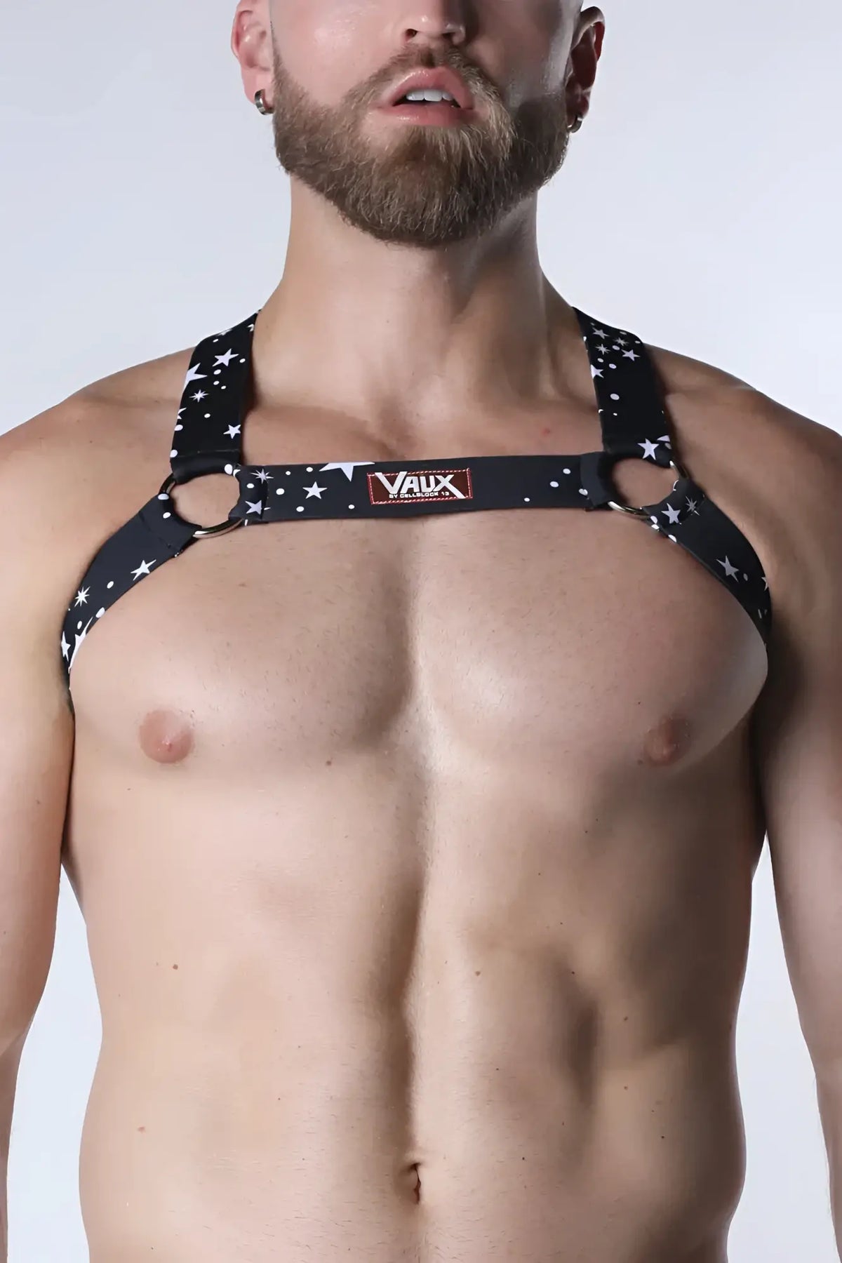 Black pulse elastic harness with star pattern metallic rings and vaux brand label visible on front side