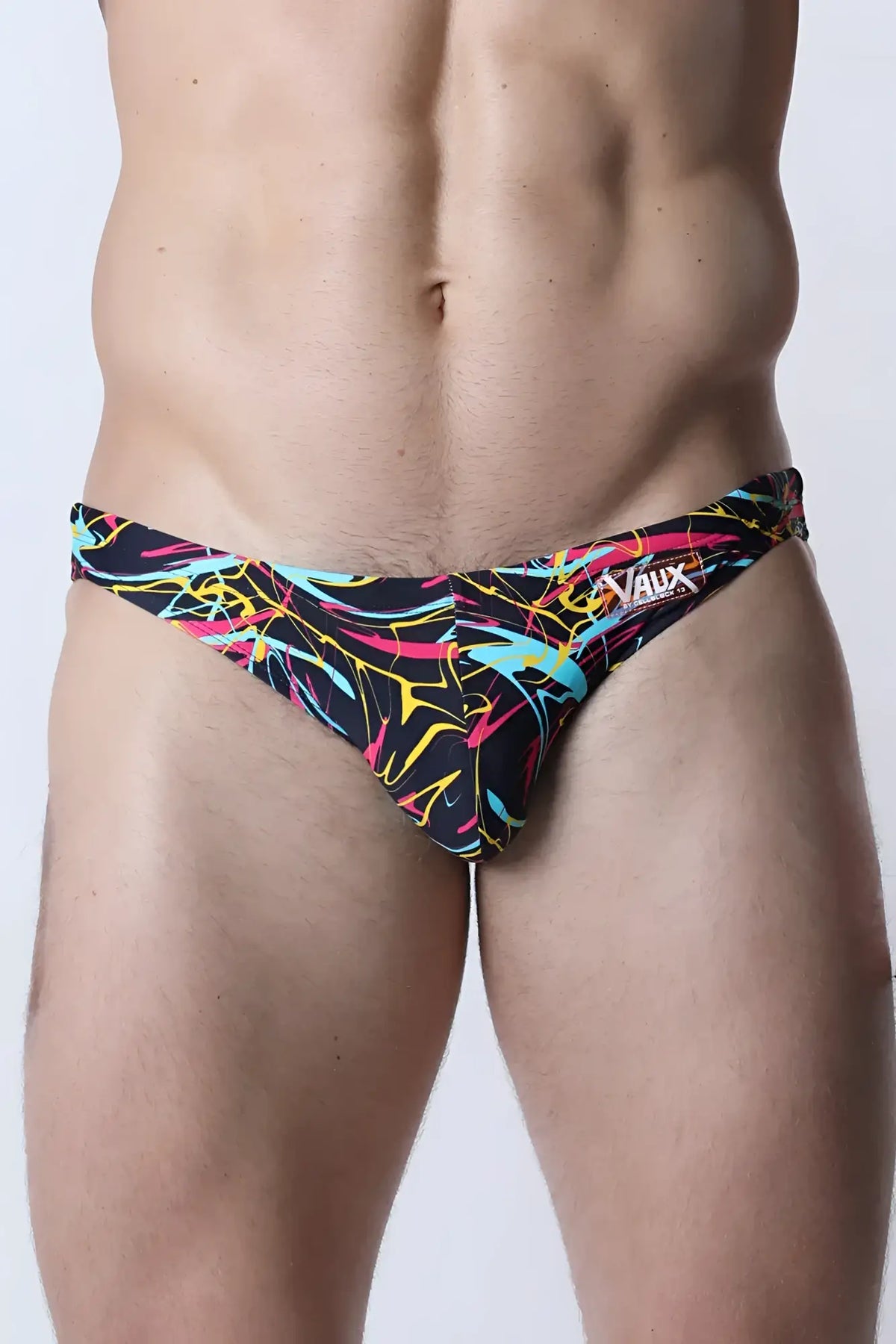 Black pulse swim brief with vibrant neon pink yellow and cyan abstract line patterns for stylish swimwear use