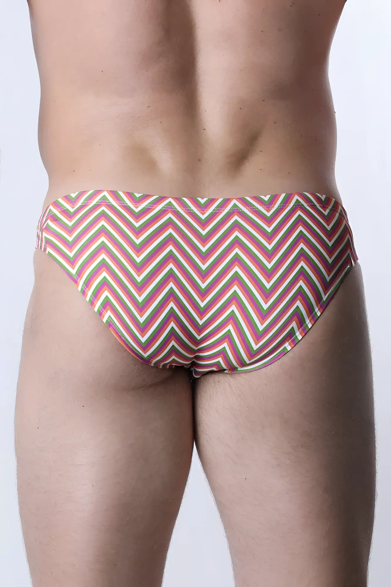 Pulse swim brief vibrant zigzag-patterned swim trunks in pink green and cream for beach and pool use