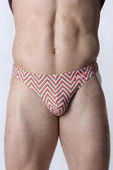 Vaux pulse swim thong men’s swim trunks with bold red green and white zigzag pattern for beachwear