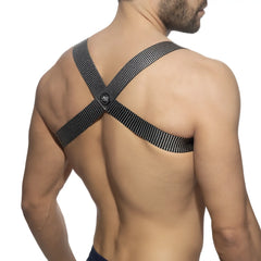 Black mesh crossback strap with skull logo at the center showing back side of pushpin spider harness