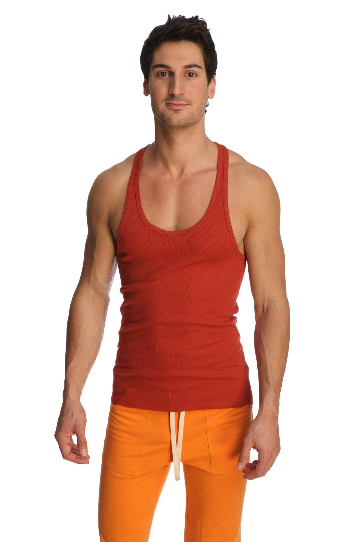 Red ribbed racer-back yoga tank in cinnabar with scoop neckline and straight hem for activewear