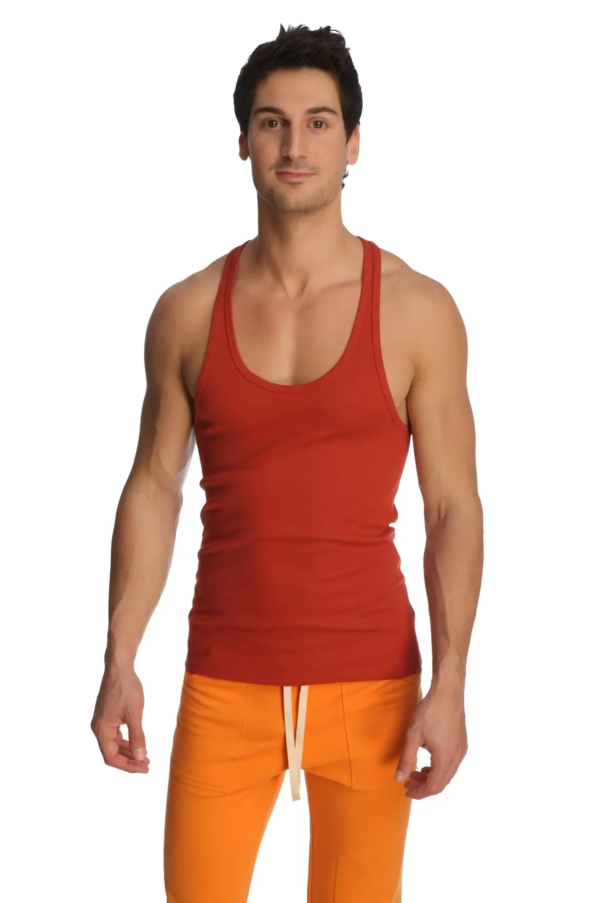 Red ribbed racer-back yoga tank in cinnabar with scoop neckline and straight hem for activewear