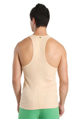 Beige racer-back yoga tank top with central seam and subtle brand tag at neckline ideal for workouts