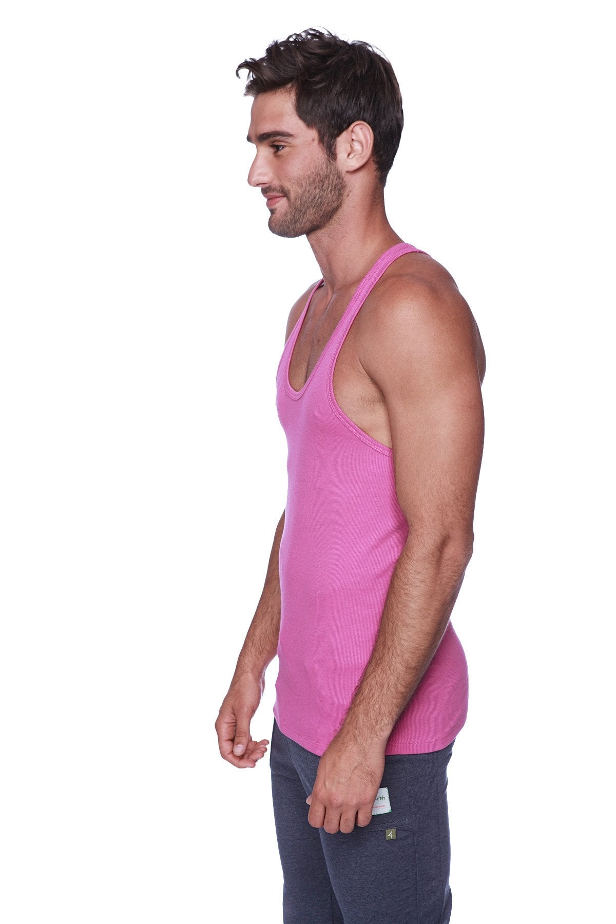 A vibrant pink sleeveless racerback yoga tank top made from smooth cotton fabric in berry color