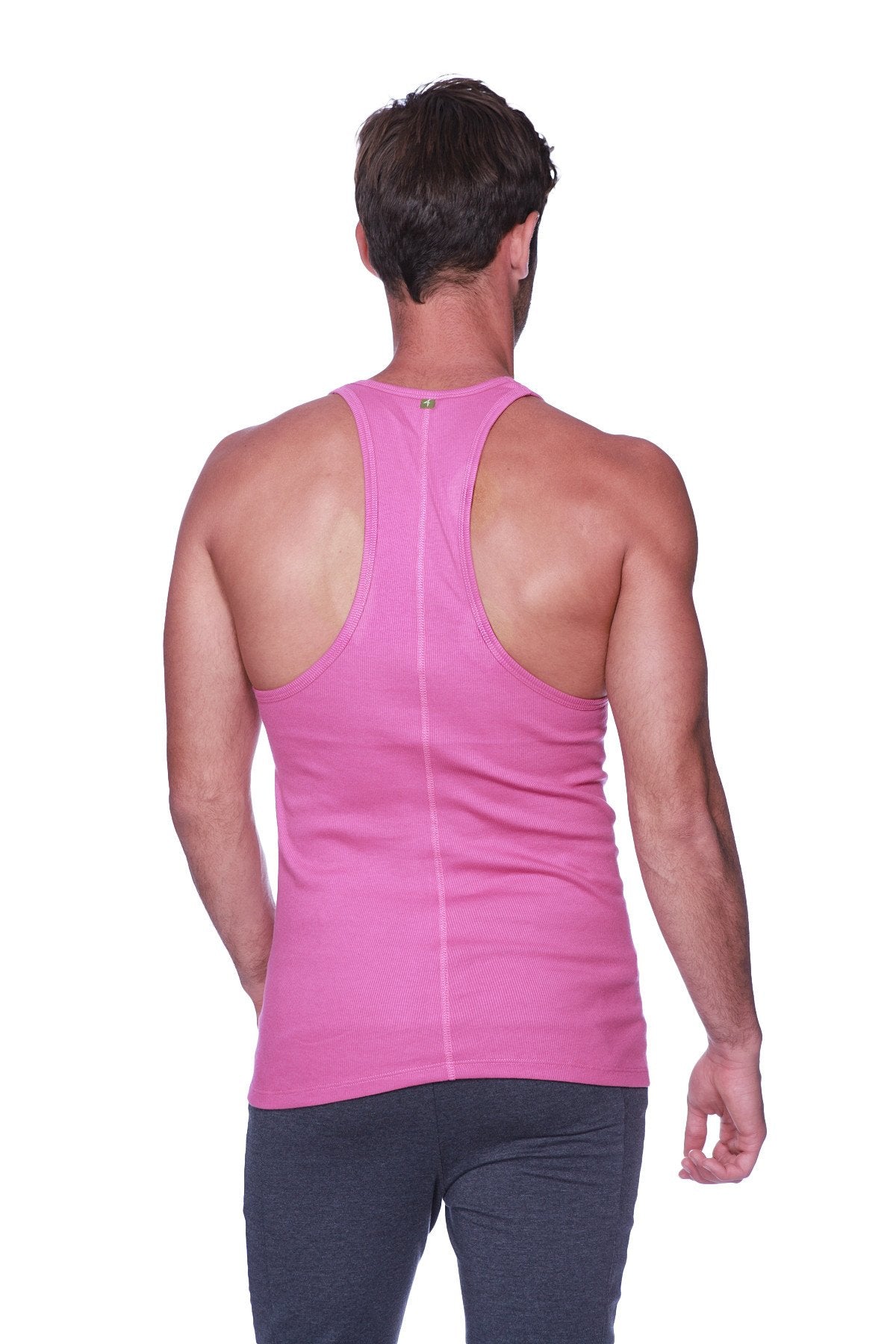 A vibrant pink racerback yoga tank top with a subtle vertical seam down the center for a form-fitting look