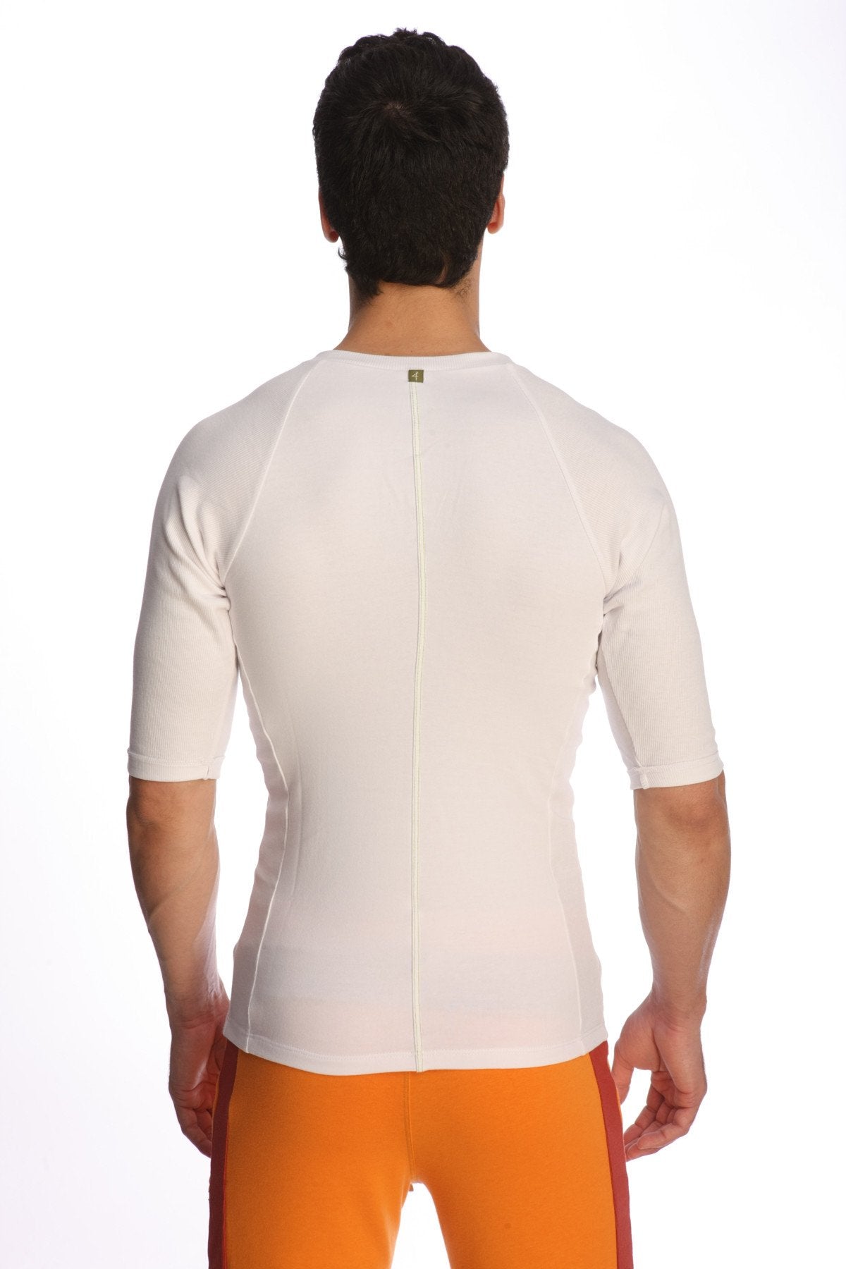 White short-sleeved raglan virtual crew neck athletic shirt with back zipper and subtle seam detailing shown from back