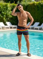 Black mesh swim shorts featuring a vibrant rainbow stripe across the waistband for stylish beachwear