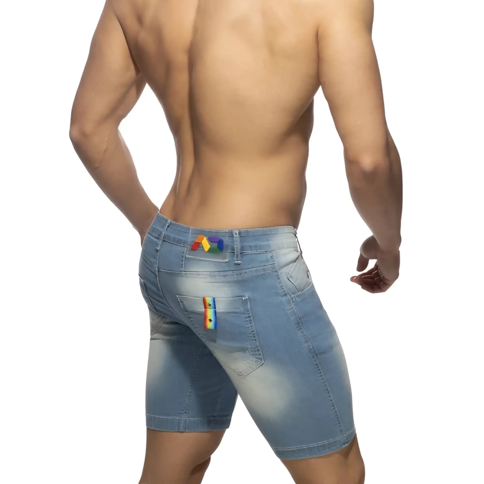 Back view of light-wash denim rainbow tape jean short with rainbow patches on waistband and right pocket