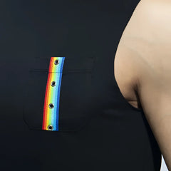 Black sleeveless rainbow tape tank top with a front pocket featuring a vertical rainbow ribbon threaded through five grommets