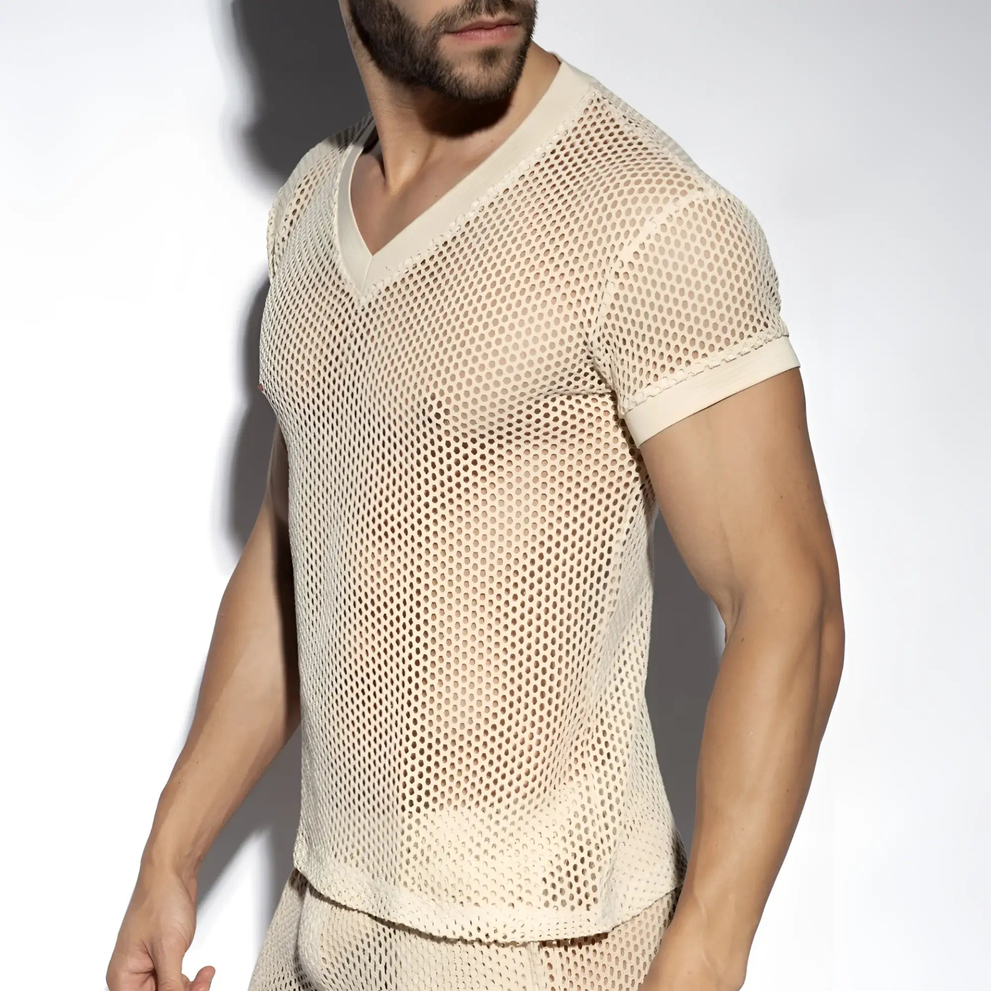 Beige raw crochet t shirt with mesh v neck short sleeves and subtle textured pattern