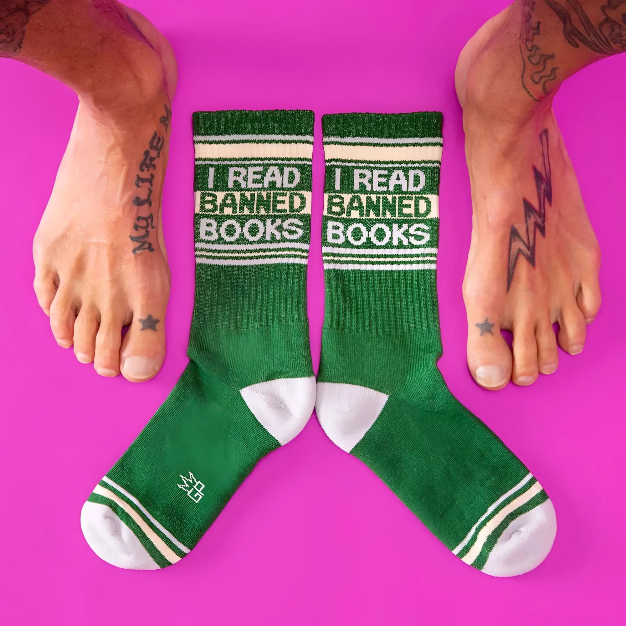 Green ribbed crew socks with white accents and black i read banned books text featuring reinforced toe caps