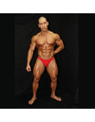 Red bikini jockstrap underwear by Arroyman featuring a snug fit and minimal coverage modeled by a muscular man.