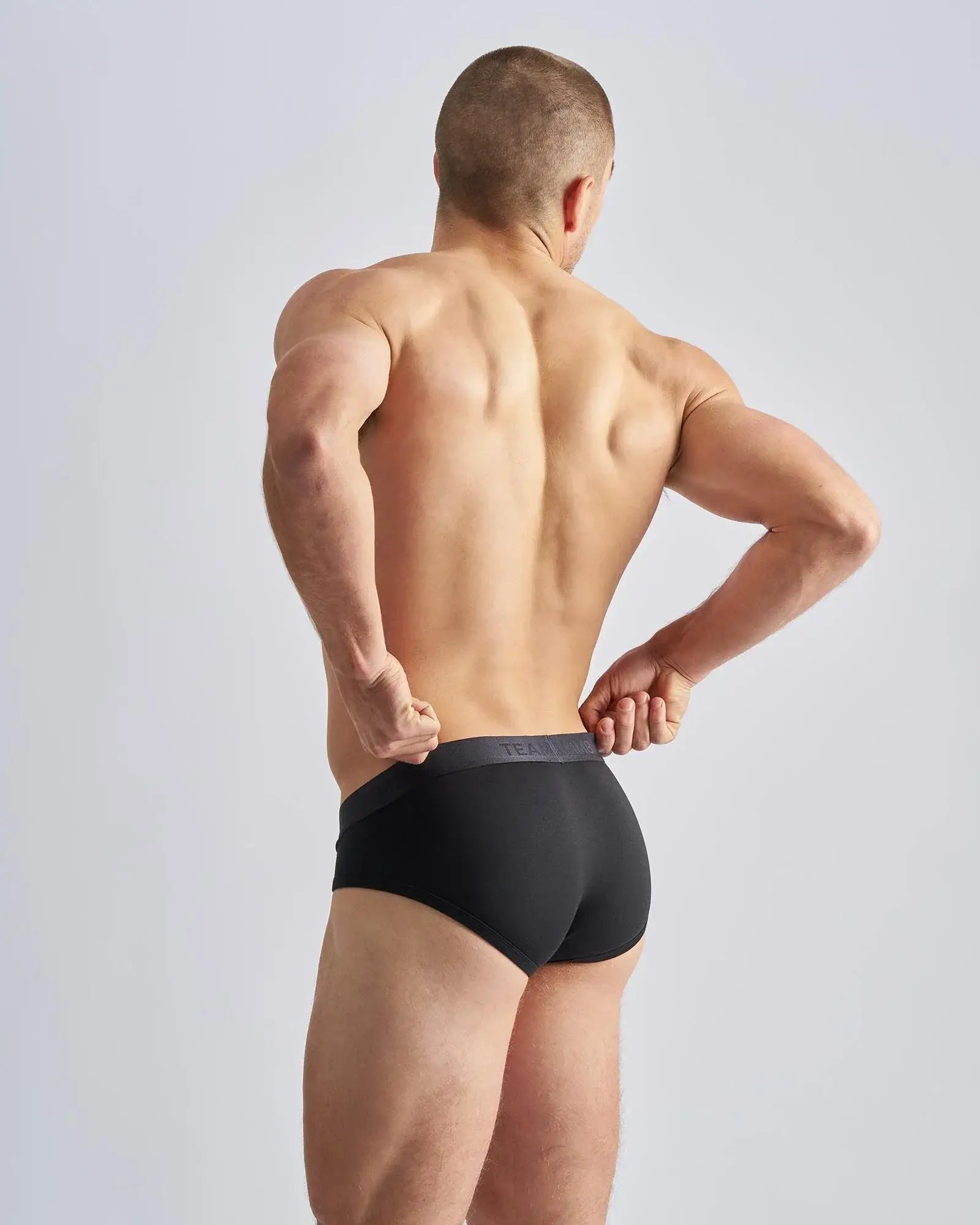 Reign brief black briefs with dark gray elastic waistband designed for comfortable all-day wear