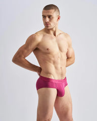 Magenta reign brief men’s underwear with form-fitting design and smooth fabric waistband featuring team logo