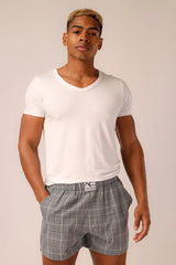 Relax boxer shorts in gray plaid with white elastic waistband and a small logo tag designed with pockets