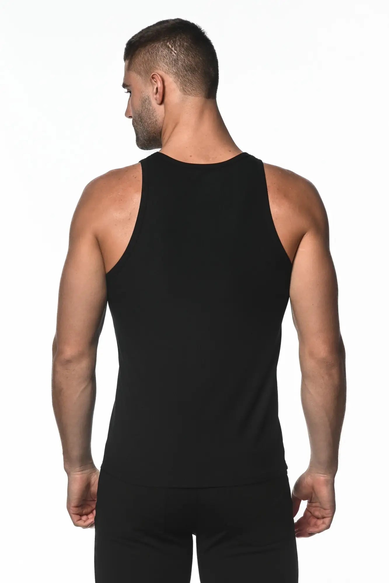 Black rib modal tank sleeveless athletic top with rounded neckline and seamless construction for activewear use