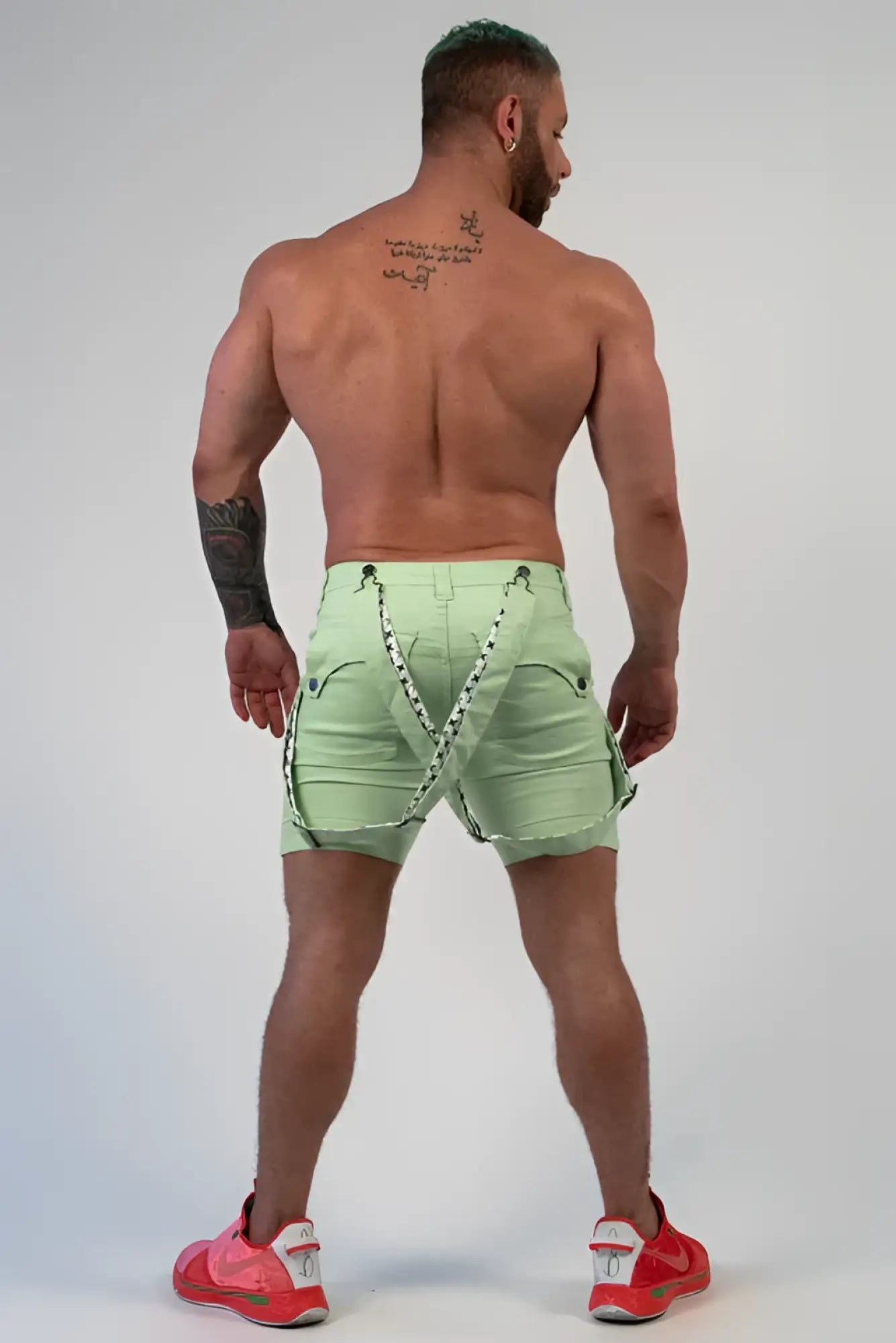 RomeY shorts light green cargo shorts back view with black and white patterned straps detail