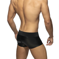 Black glossy-finish men’s briefs with a snug fit and front to back zip in the RUB TRUNK collection