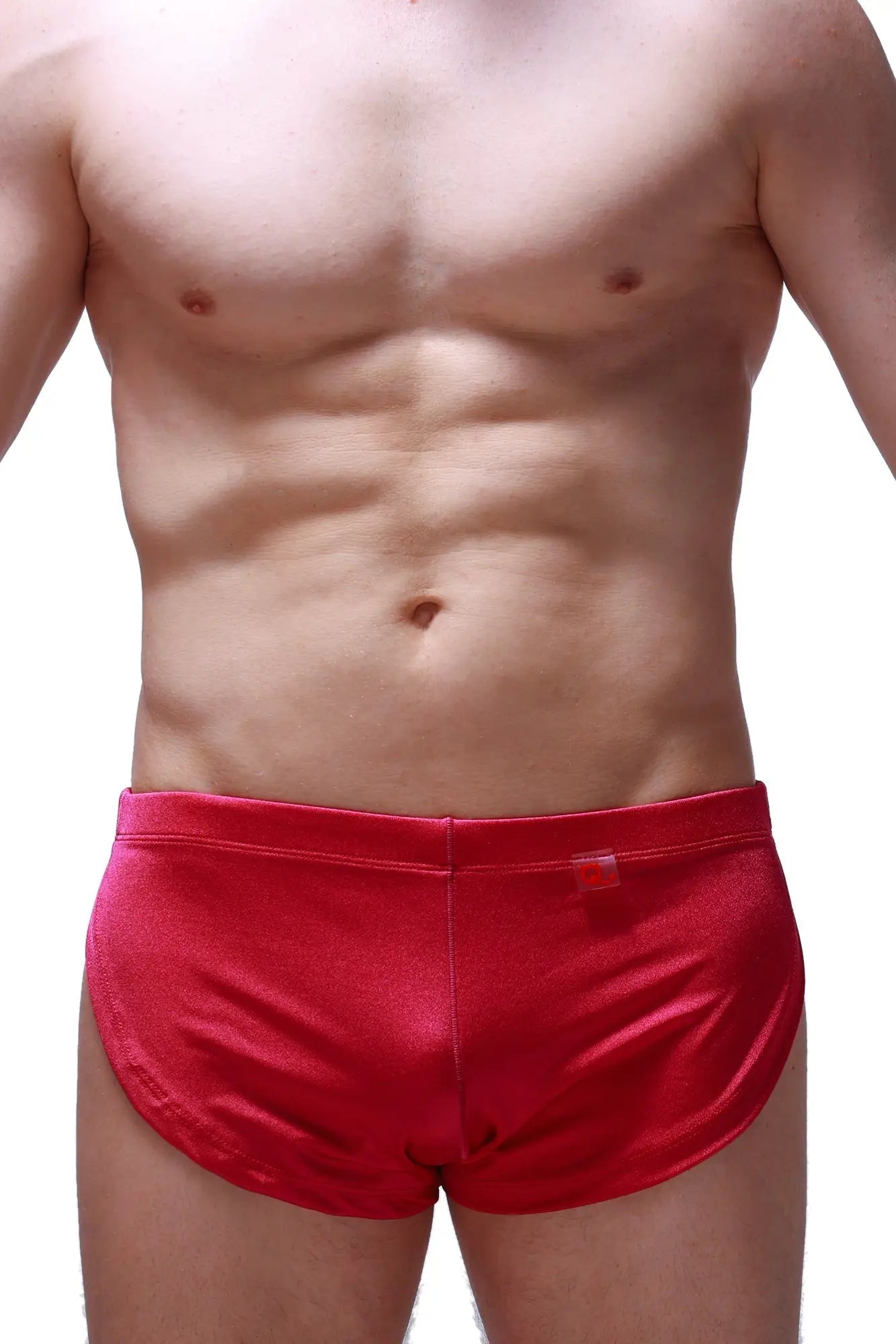 Red satin running shorts joe framboise with smooth shiny finish and small red tag on the waistband