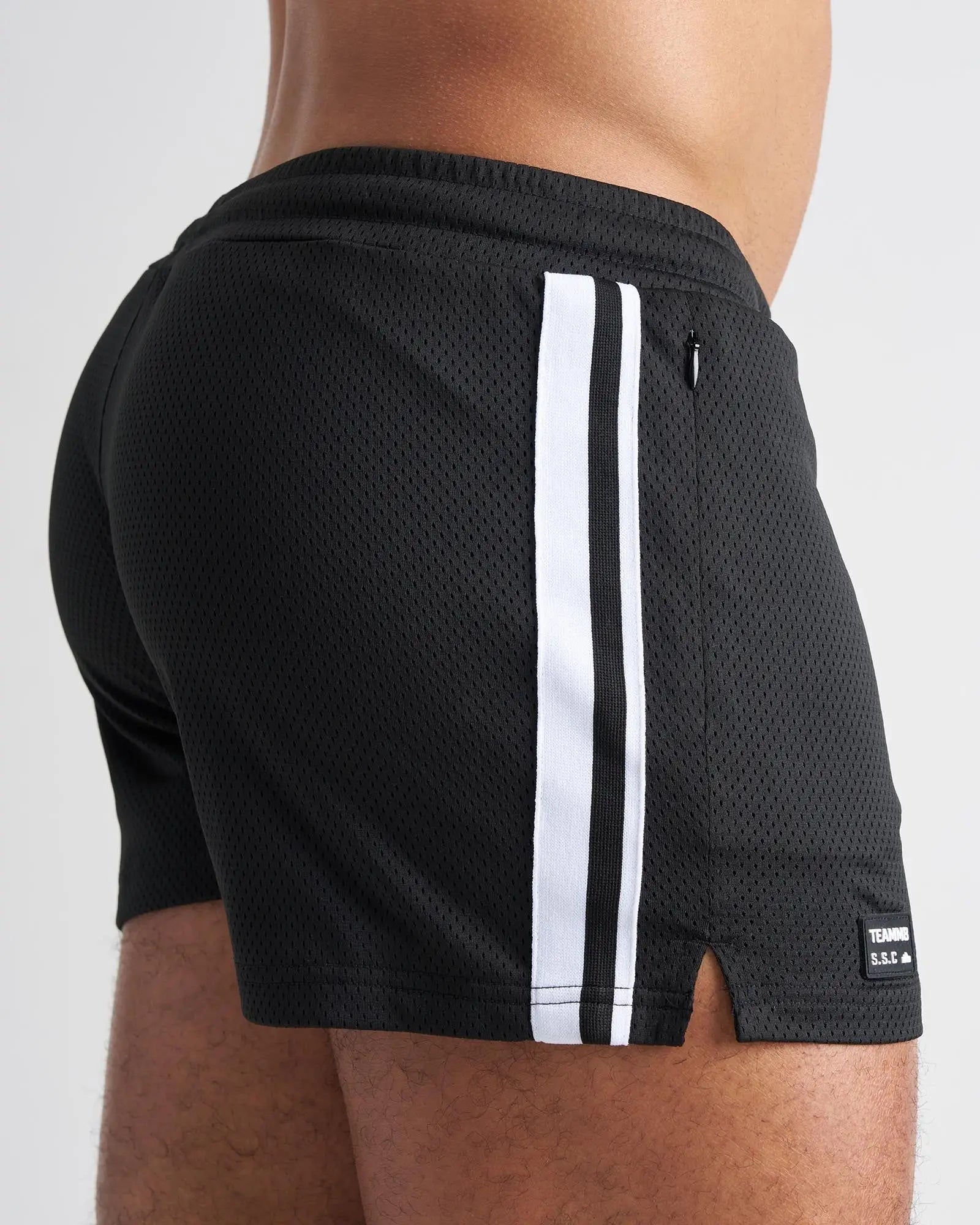 Black mesh athletic shorts with two white stripes and brand tag s s c fraternity 3 inch mesh short