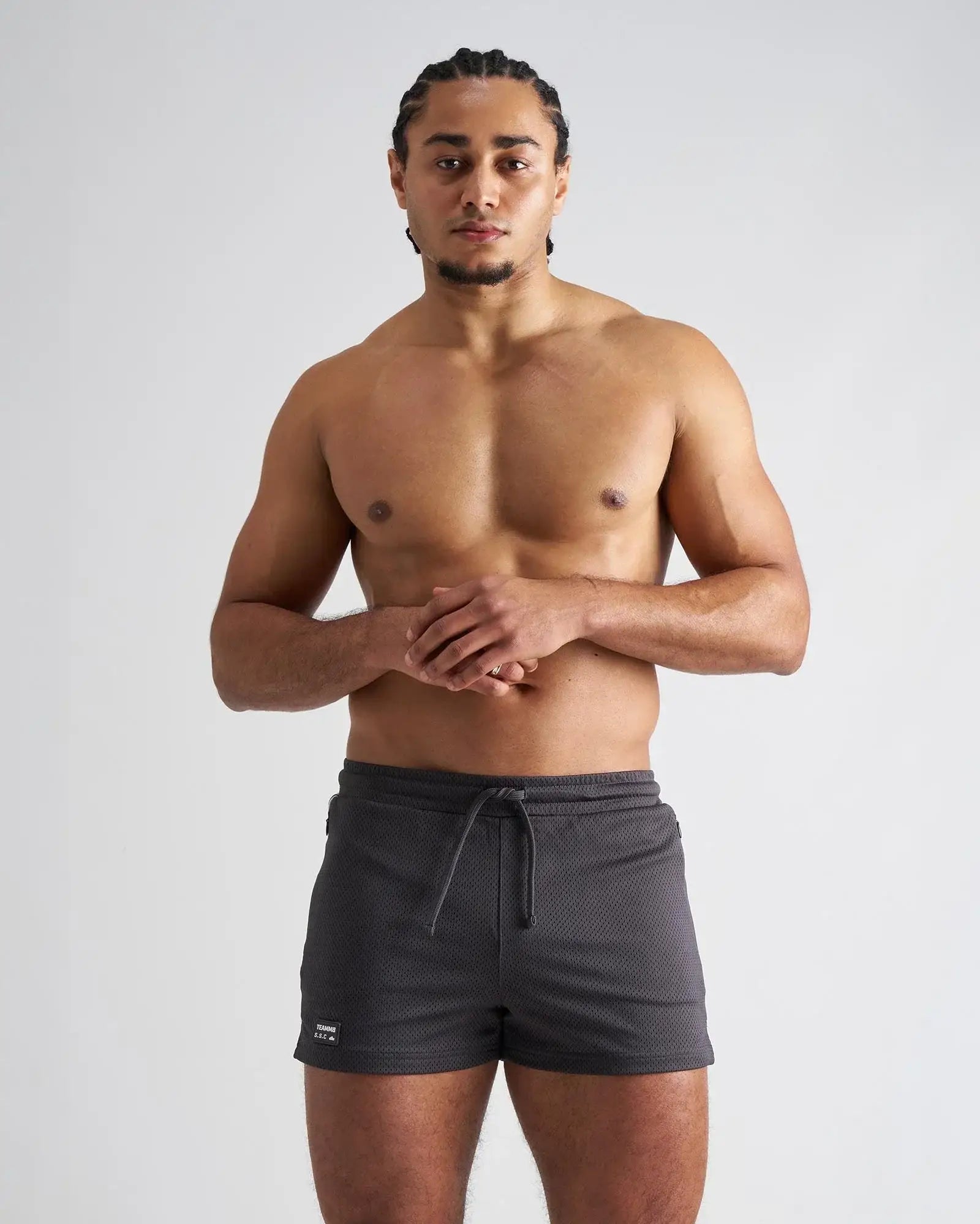 Dark gray s.s.c. fraternity 3 inch mesh shorts with drawstring waistband and brand tag on lower left leg