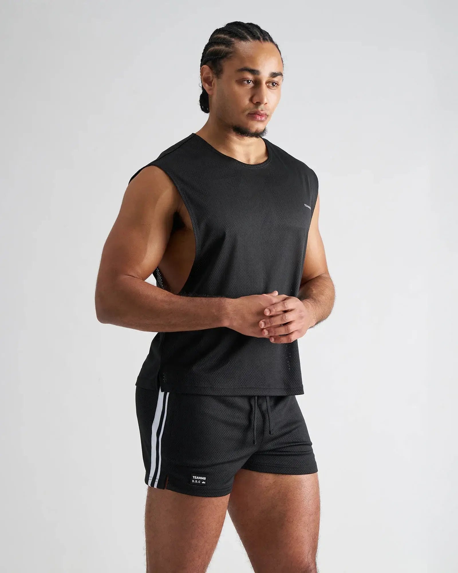 Black s.s.c. mesh muscle tank sleeveless athletic top with textured mesh fabric and subtle side vents for breathability