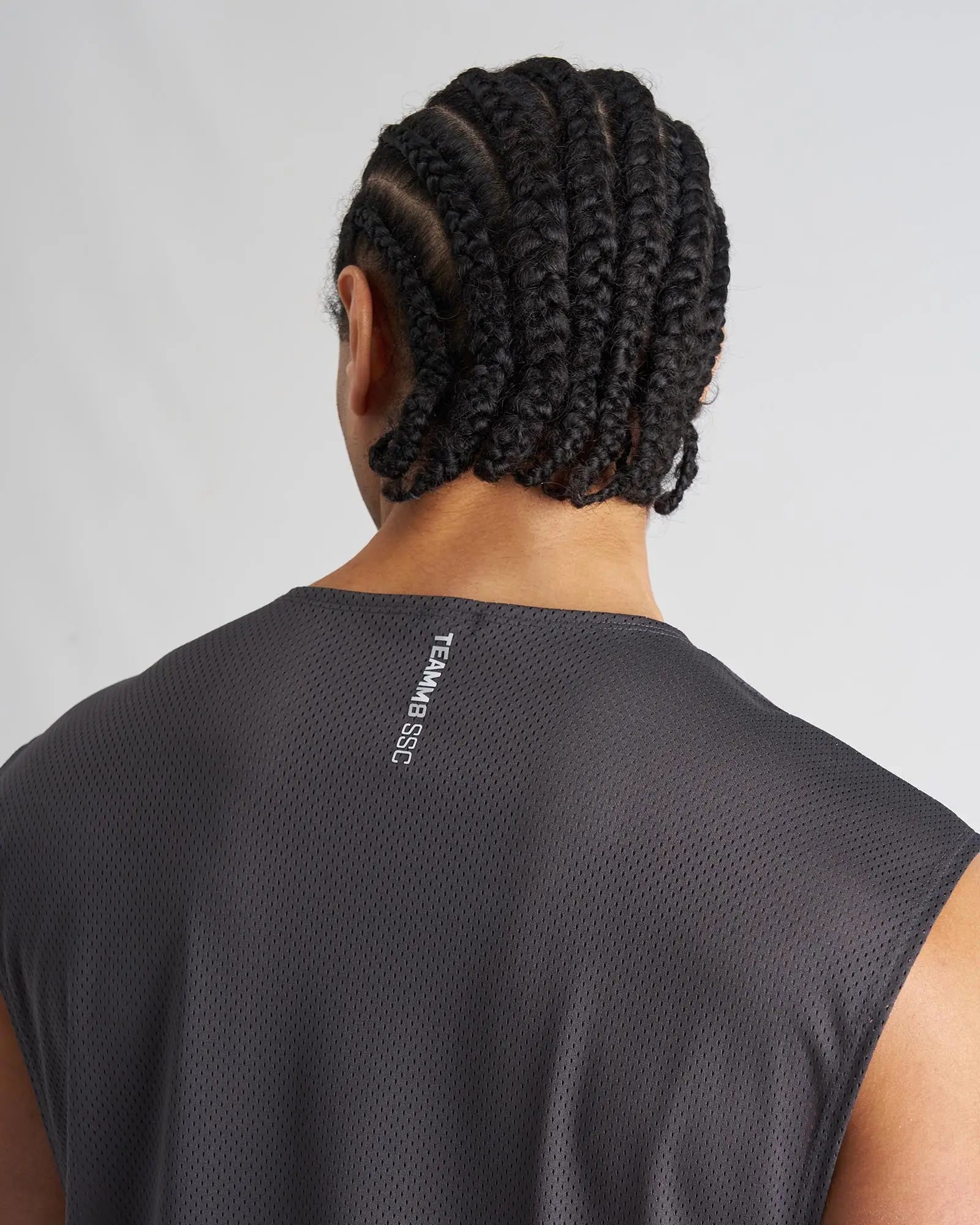 Dark gray mesh sleeveless S.S.C. muscle tank with team b ssc branding on the back neck in the back view