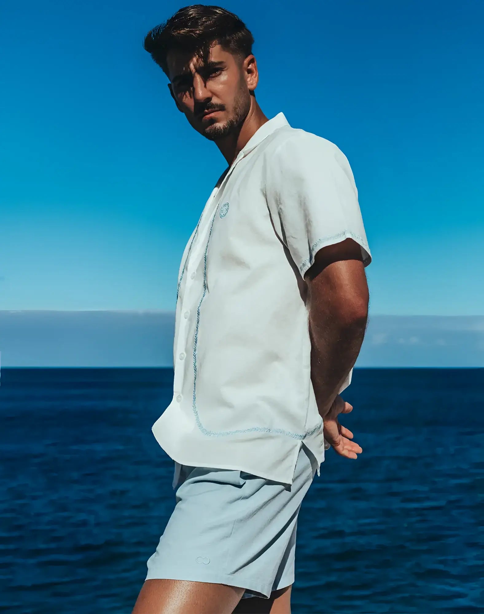 Light blue santorini linen shirt with short sleeves button-up front and subtle stitching details