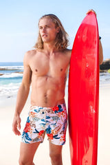 Vibrant red glossy surfboard paired with sauvage laguna boardwalk white floral swim shorts size m