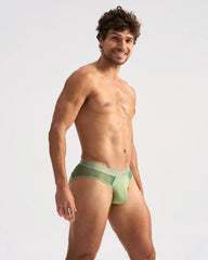 Light green score sheer brief with seamless design, subtle mesh side panel, and elastic waistband for comfort