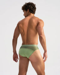 Light green score sheer brief with form-fitting fit mesh back panel and elastic waistband with faint branding visible from back